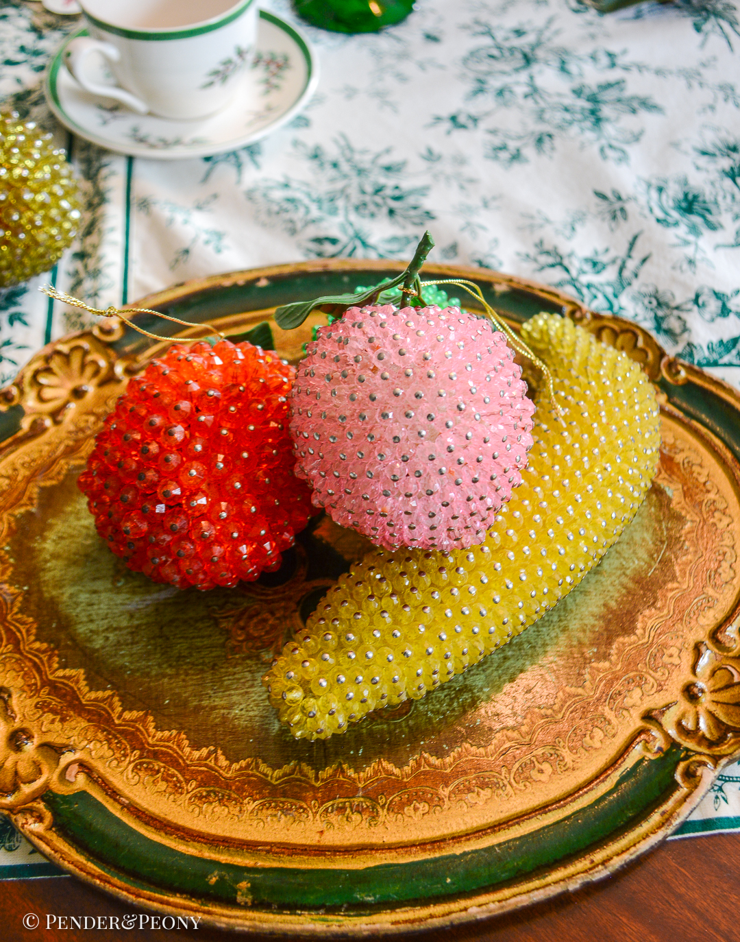 Group of 4 beaded fruits: banana, peach, orange, and lime