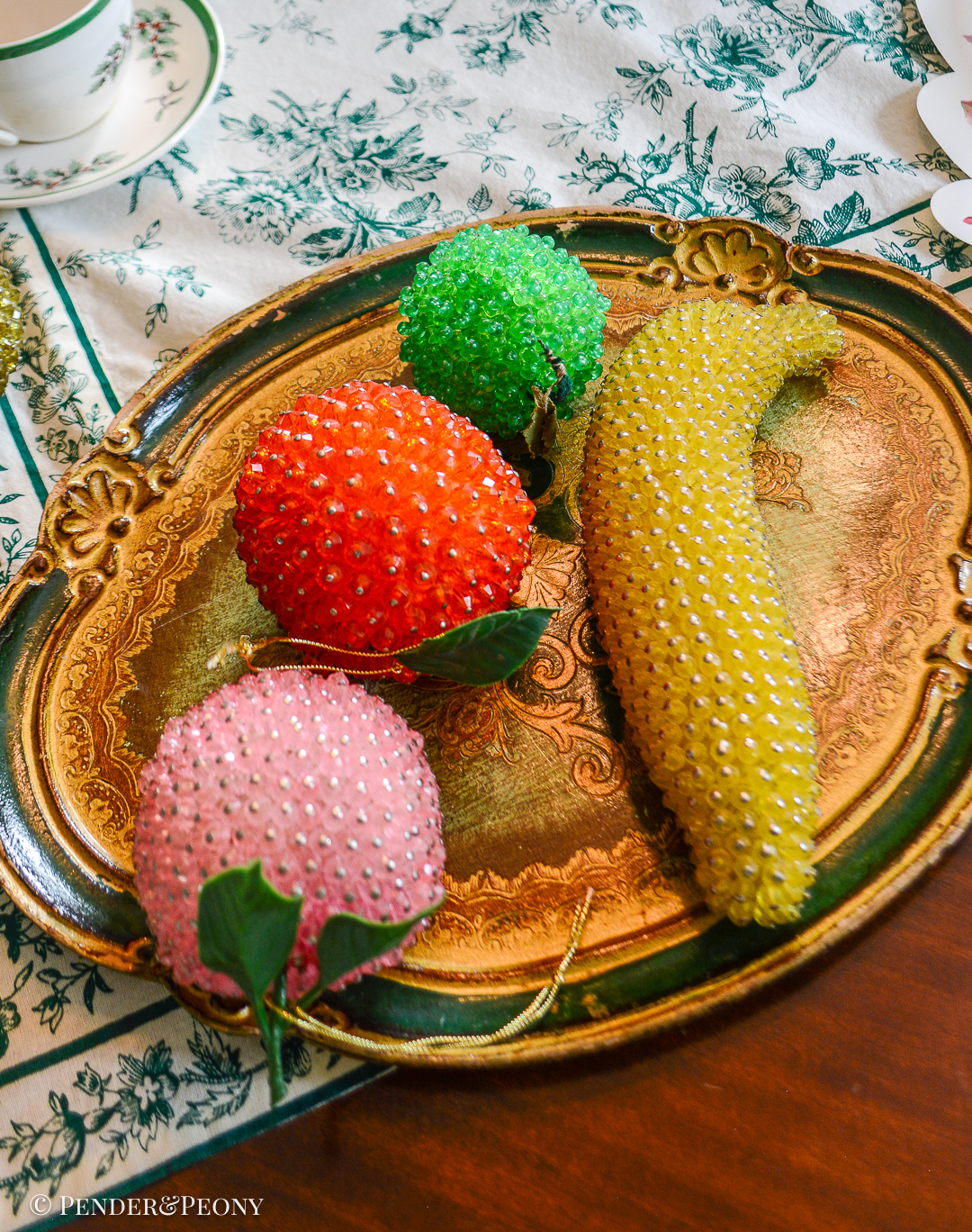 Group of 4 beaded fruits: banana, peach, orange, and lime
