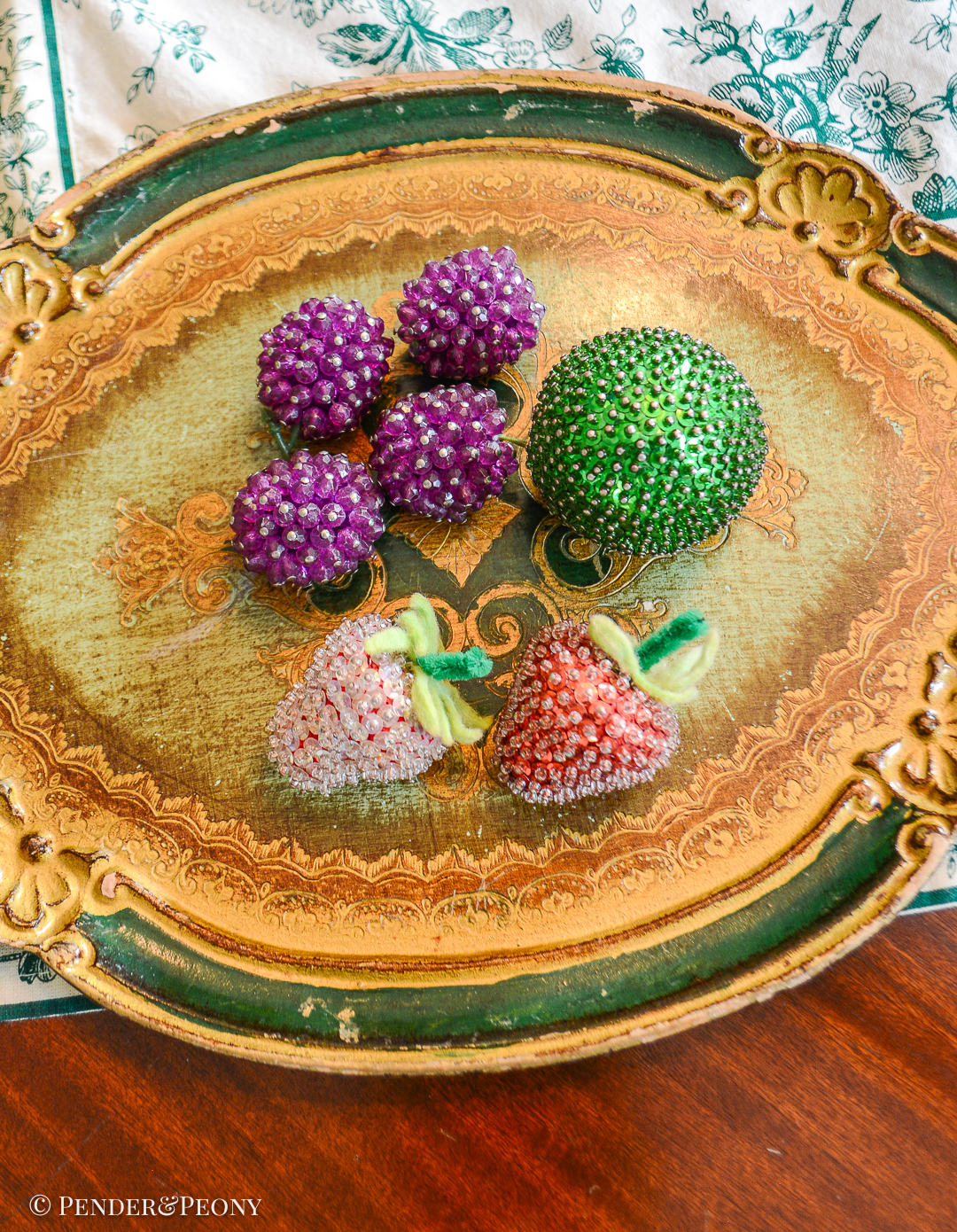 Group of 7 vintage beaded fruits: grapes, strawberries, and a lime