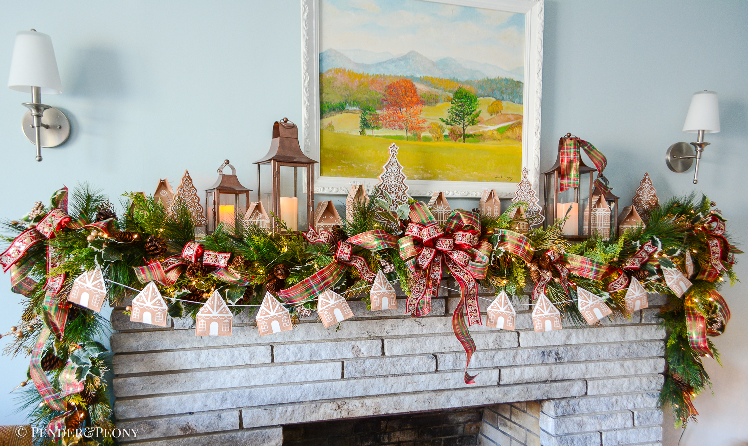 Come explore the fireplace Christmas decorations in our family room where a gingerbread village nestles amongst the holly and pine in this gorgeous garland idea