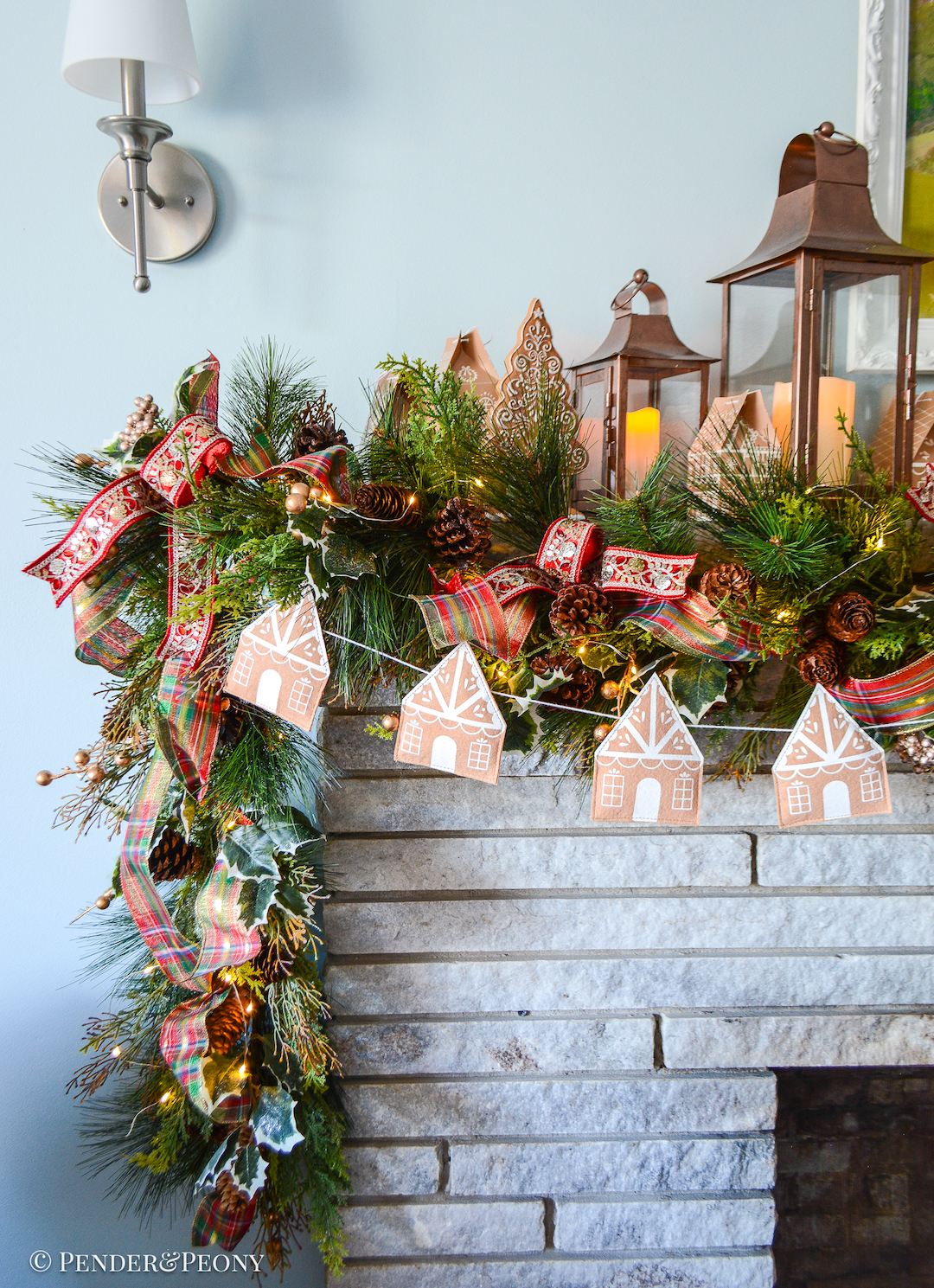 Come explore the fireplace Christmas decorations in our family room where a gingerbread village nestles amongst the holly and pine in this gorgeous garland idea
