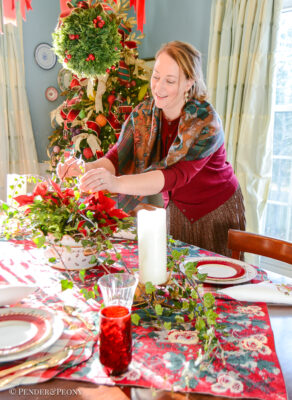 Making Christmas magic with classic Christmas table decor - setting the table in elegant red, green, and white with chintz, Johnson Bros, plaid, and Royal Worcester