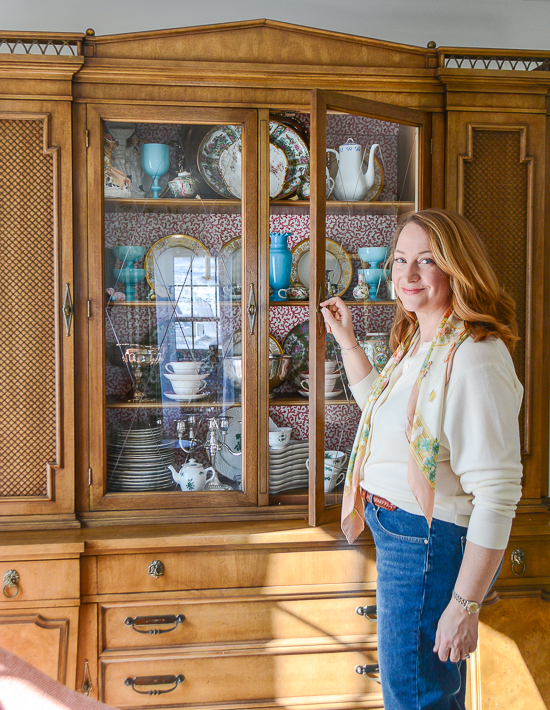 Katherine opening china cabinet door