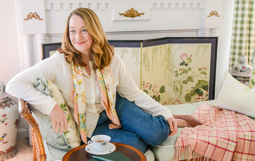 Katherine curled up on daybed in living room
