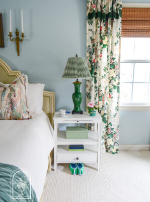 White step back nightstand with green Chinese lamp and gingham shade