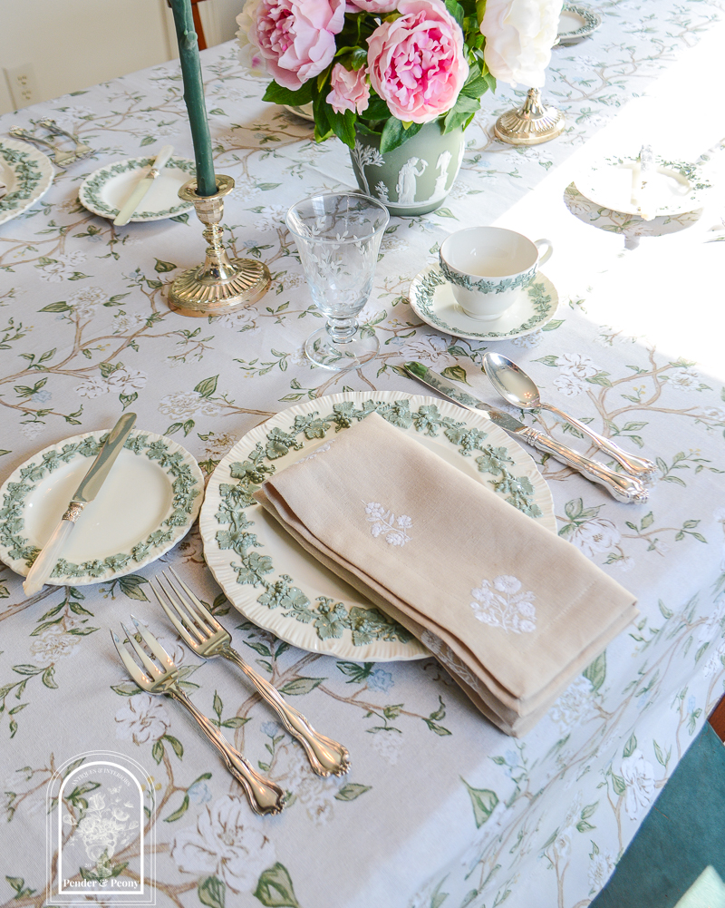 Spring table decor with Wedgwood Queen's Ware embossed dishes, embroidered floral linens, and antique silver