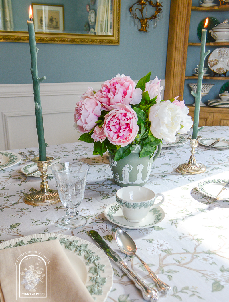 pink peonies in green Jasperware pitcher on elegant spring table