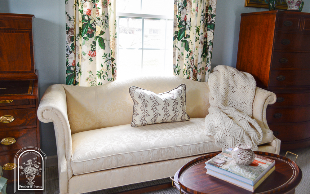 Ivory damask camel back sofa