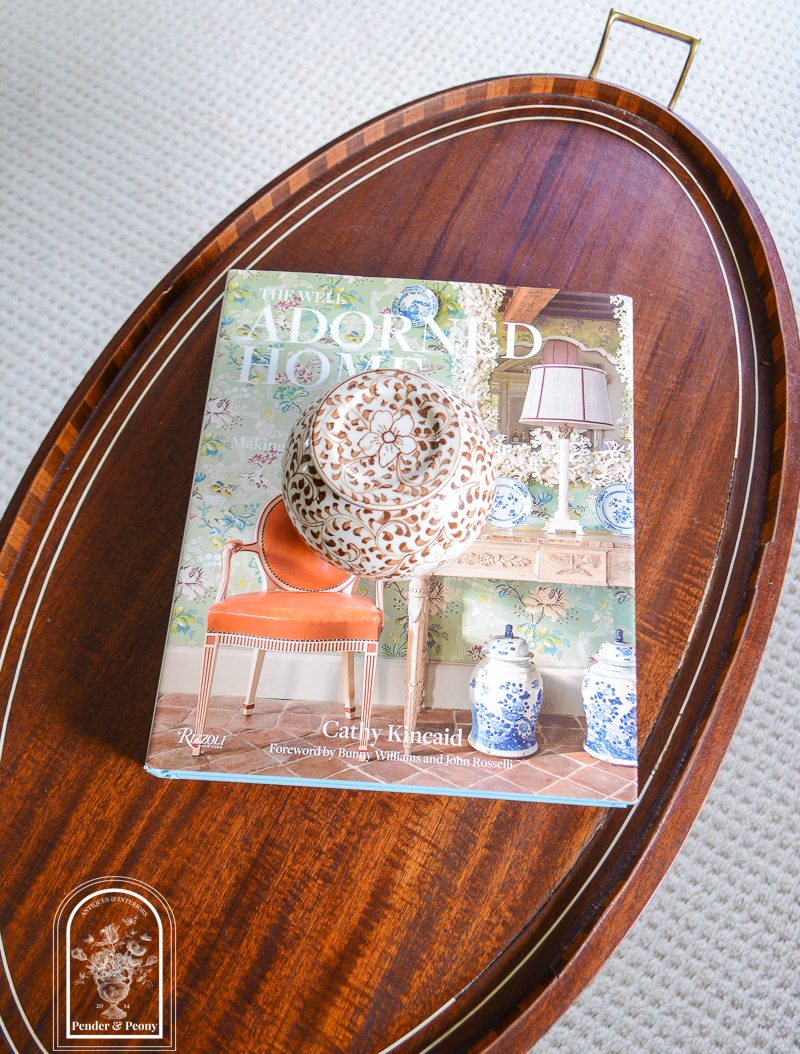 top view of tray top table with books and floral jar