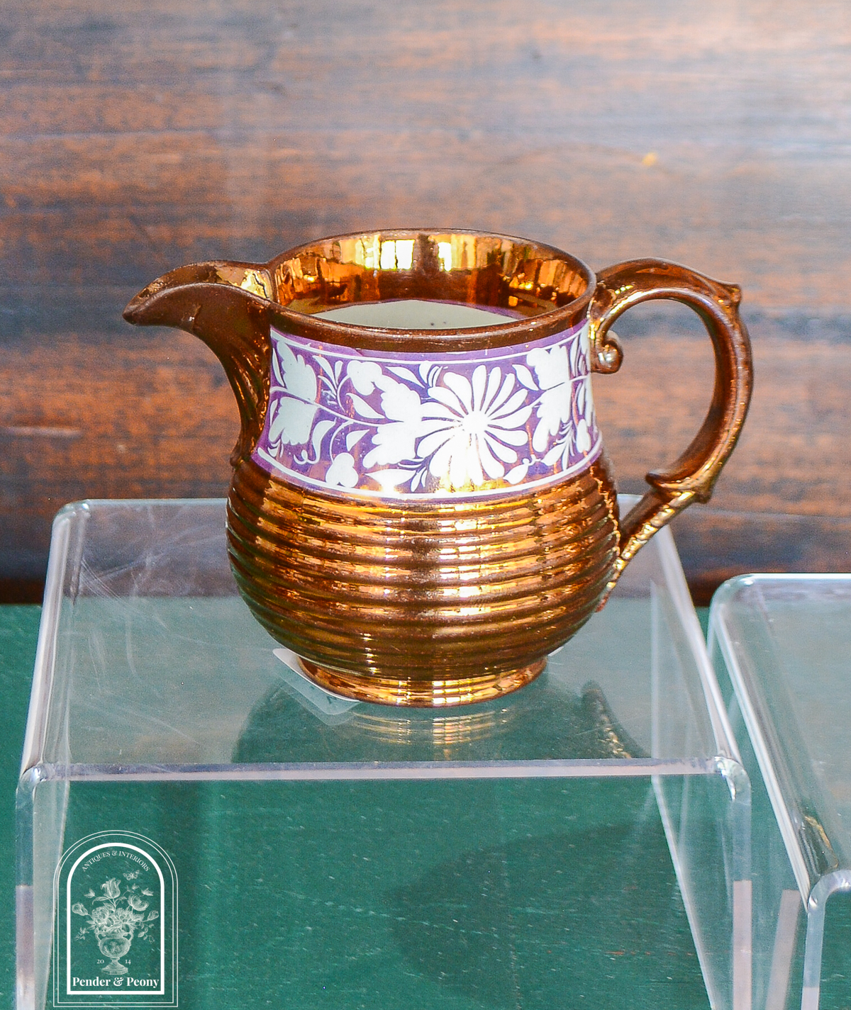 Copper lustre jug with pink and white floral band