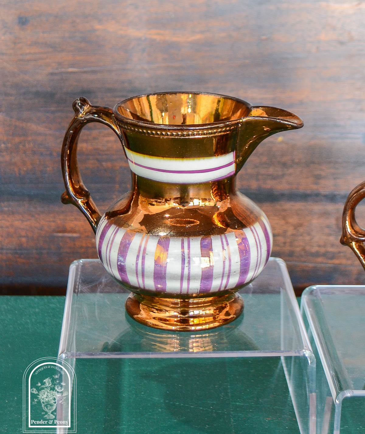 Copper lustre jug with vertical stripes