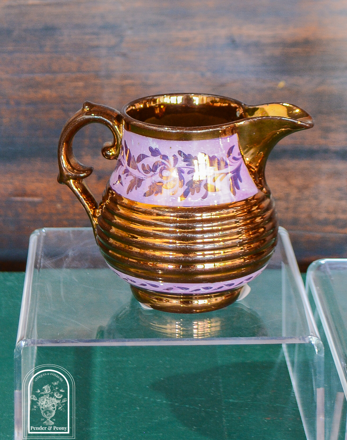 Copper lustre jug with pink vines