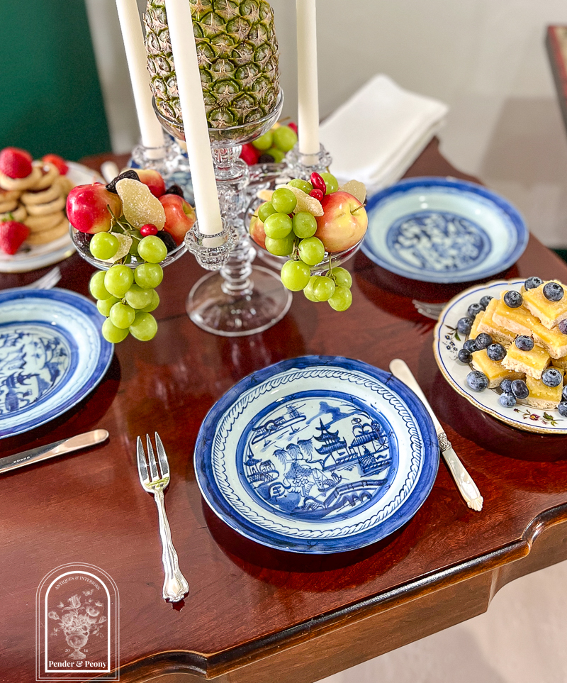 Tablescape inspired by the Federal era dessert tables with glass epergne, pineapple, Blue Canton, and pyramid stacked sweetmeats