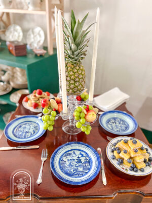 Tablescape inspired by the Federal era dessert tables with glass epergne, pineapple, Blue Canton, and pyramid stacked sweetmeats