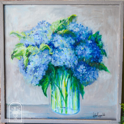 Painting of blue hydrangea blooms in vase by TN artist Lydia Reynolds