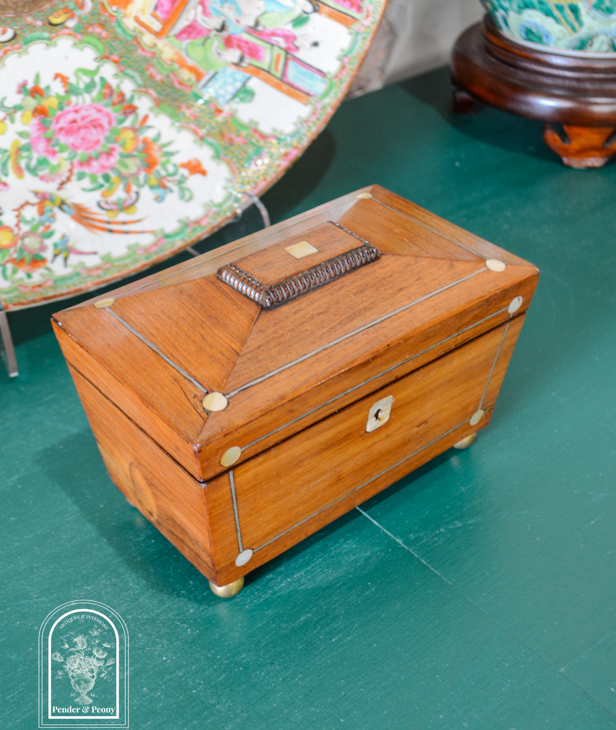 English Regency sarcophagus tea caddy with mother of pearl and pewter inlay