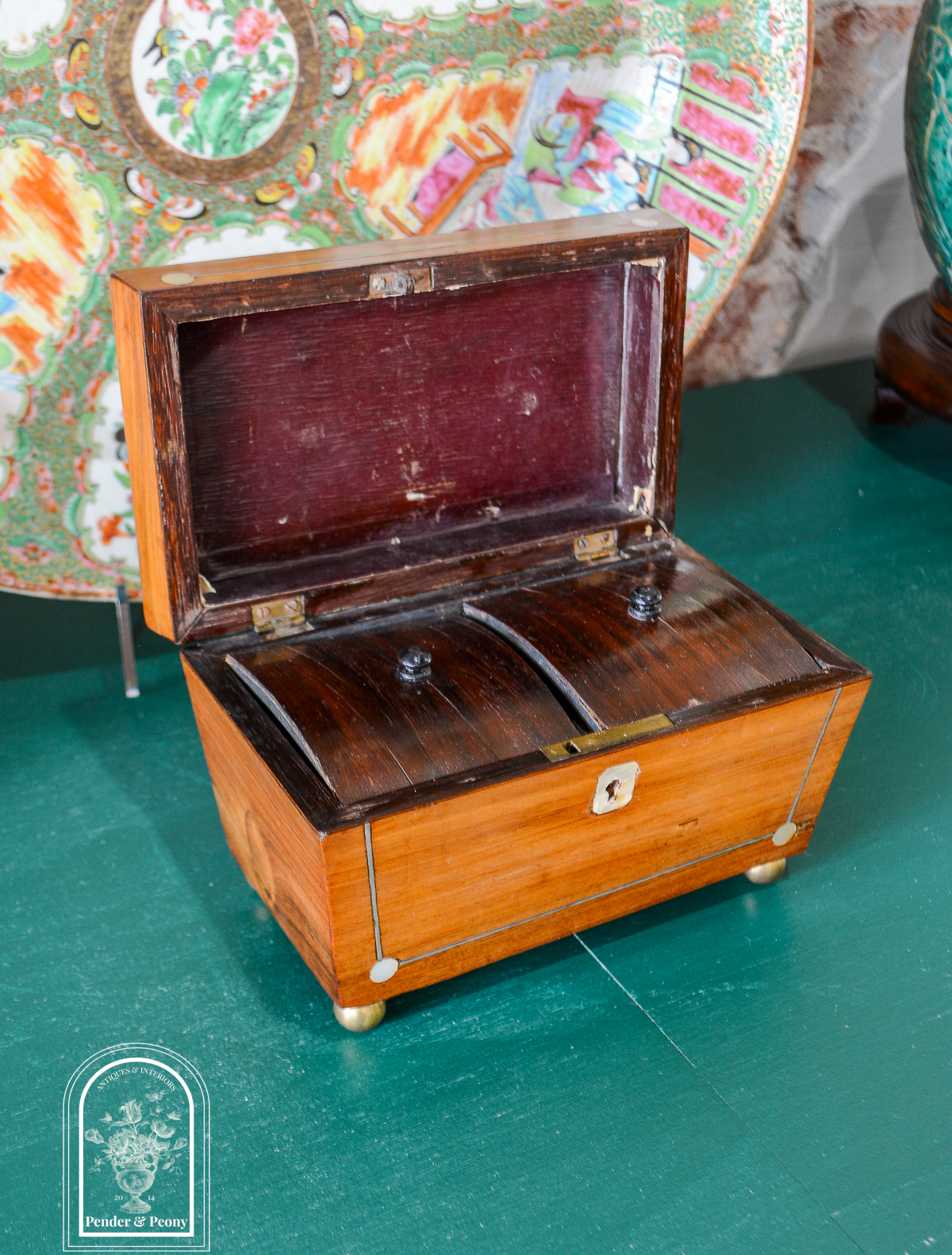 English Regency sarcophagus tea caddy with mother of pearl and pewter inlay