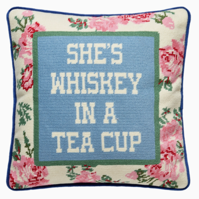 needlepoint pillow with saying: "She's Whiskey in a Teacup"