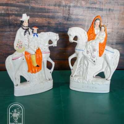 Pair of Staffordshire flatback gypsy on horseback holding children