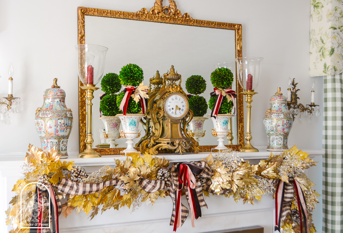 Elegant fall mantel garland in gold maple leaves with brown, pink, and burgundy bows