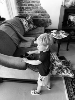 James playing with diggers in the antique shop