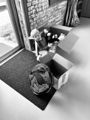 James playing in boxes in the antique shop
