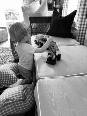 James playing in the formal living room on the vintage wicker daybed