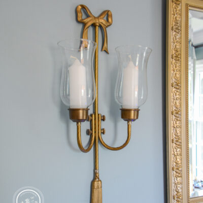 Pair of brass bow candle sconces