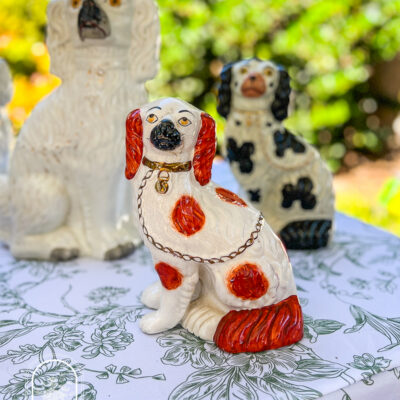 Red and white Staffordshire Spaniel with copper lustre chain and detached front foot, 19th century, English -- shop on penderandpeony.com