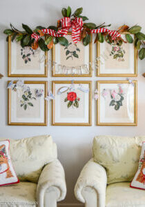 12 Days of Christmas banner hung on camellia prints with magnolia garland above