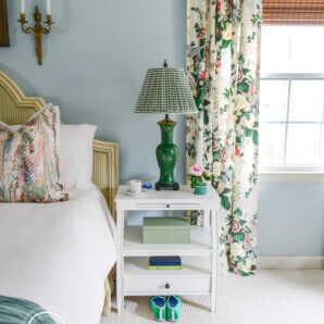 White step back nightstand with green Chinese lamp and gingham shade