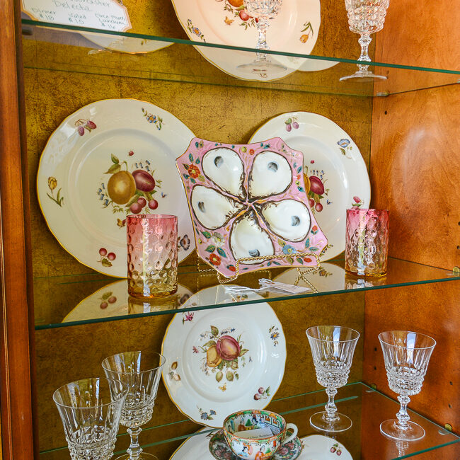 Styled shelves inside china cabinet
