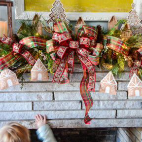 Come explore the fireplace Christmas decorations in our family room where a gingerbread village nestles amongst the holly and pine in this gorgeous garland idea