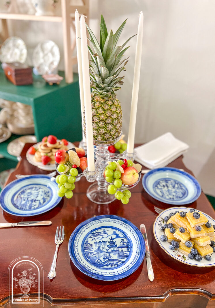 Tablescape inspired by the Federal era dessert tables with glass epergne, pineapple, Blue Canton, and pyramid stacked sweetmeats