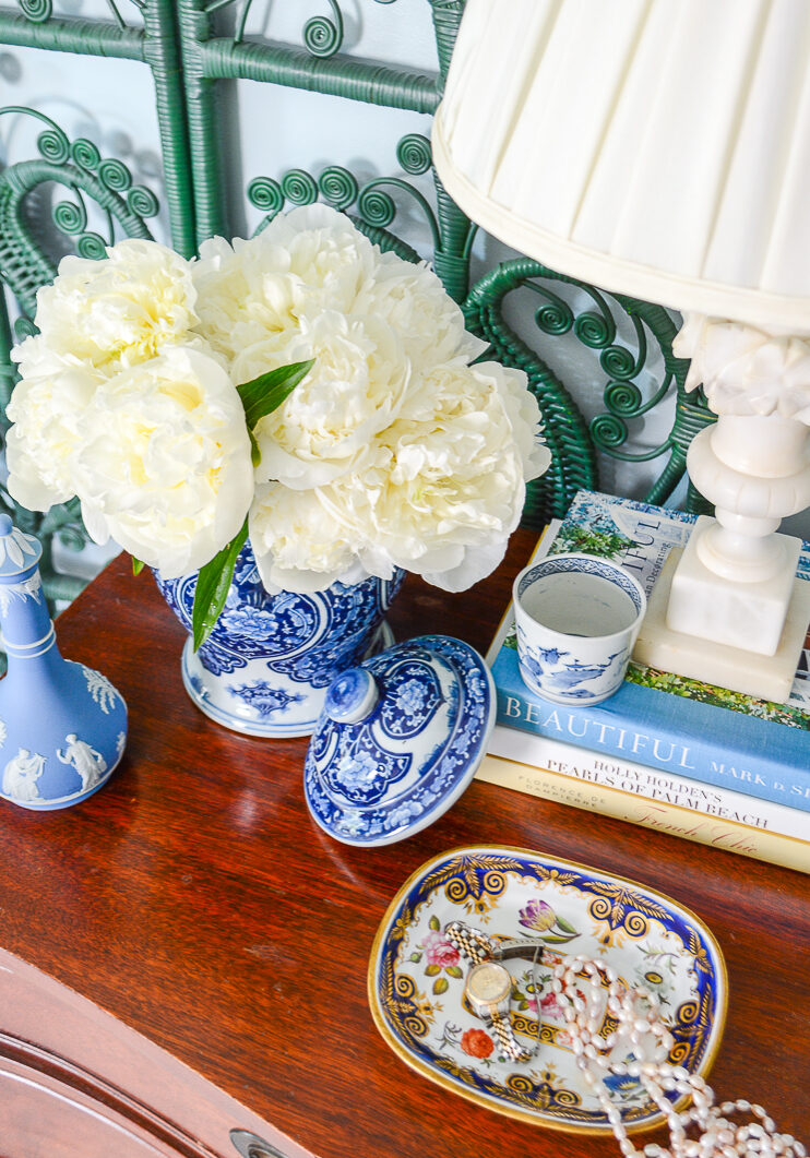 Here's why I'm picky about blue and white ceramics...Blue and white Chinese jar with white peonies on dresser with Wedgwood and marble lamp