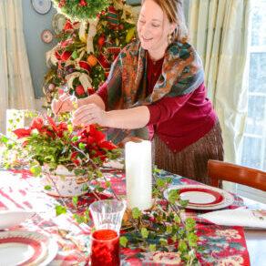 Making Christmas magic with classic Christmas table decor - setting the table in elegant red, green, and white with chintz, Johnson Bros, plaid, and Royal Worcester
