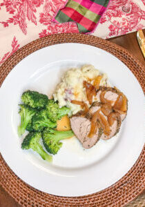 Plated pork loin, mashed potatoes, and broccoli for a delicious Sunday supper menu idea