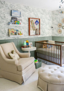 Tips for designing a nursery. Nursery rocker in green boy's nursery with woodland themed wallpaper and decor